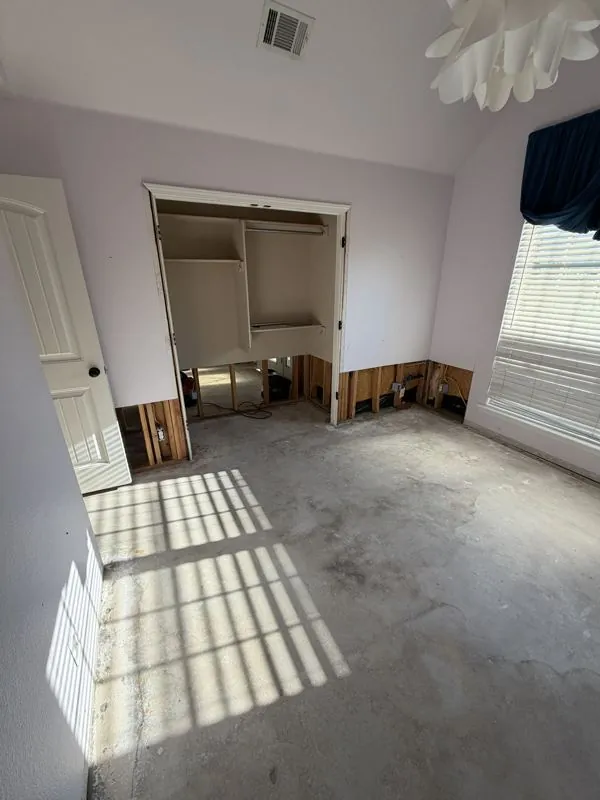 Wet carpet and drywall removed, closet cavity opened